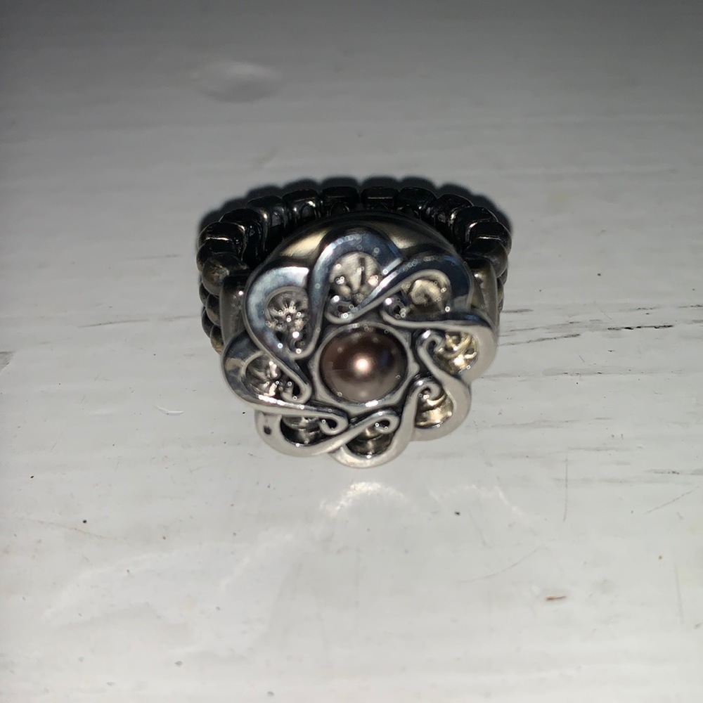 One antique brass stretch band snap ring with one snap.  NWOT